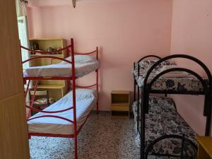 Postel nebo postele na pokoji v ubytování Casa vacanze a due passi dalla stazione
