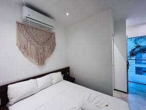 Postel nebo postele na pokoji v ubytování Coco Live Suites