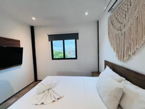 Postel nebo postele na pokoji v ubytování Coco Live Suites