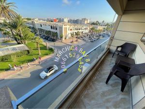 a view of a street from a balcony with a car on the road at Marchica bay 8 holiday Apartment in Nador