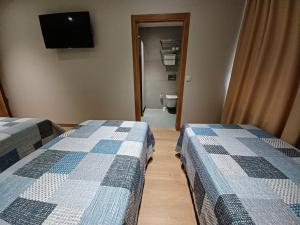 Postel nebo postele na pokoji v ubytování Hosteria de Gonzar