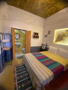 Postel nebo postele na pokoji v ubytování Riad Tigmi du Soleil