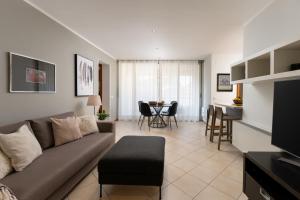 a living room with a couch and a table at Apartments Casa Emonia in Novigrad Istria