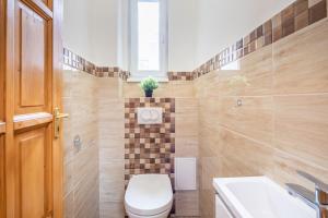 a bathroom with a toilet and a sink at Star House in the city in Budapest +6 photos