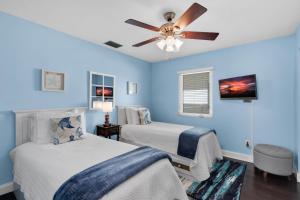 Ένα ή περισσότερα κρεβάτια σε δωμάτιο στο Tropical Therapy +31 φωτογραφίες