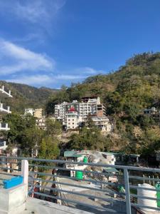 a group of buildings on a hill with buildings at Blissfull stay midsts nature in Rishīkesh