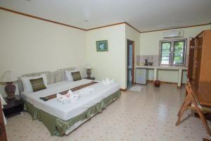 Postel nebo postele na pokoji v ubytování Ladda Resort