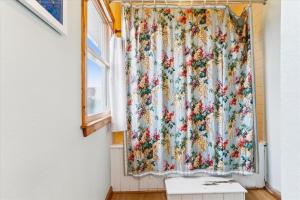 a window with a floral curtain on a wall at D130 - Shannon in Duck +28 photos