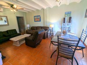 a living room with a couch and a table at Sea Breeze Retreat 301 in Puerto Peñasco