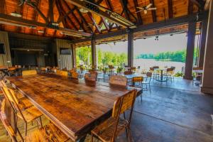 a large wooden table in a large room with chairs at Golf Club Villas in Marblehill +34 photos