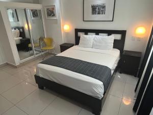 Postel nebo postele na pokoji v ubytování City Caribbean Hotel Boutique