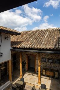an outside view of a house with a roof at Corazón Del Café Hotel Boutique in Comitán