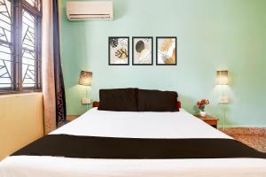 Letto o letti in una camera di Collection O Gauravaddo Calangute