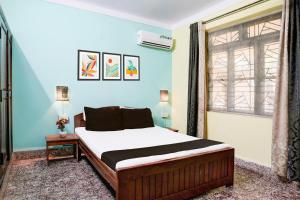 Letto o letti in una camera di Collection O Gauravaddo Calangute