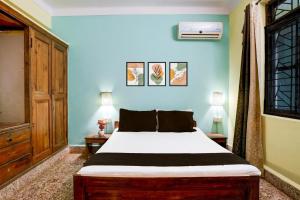 Letto o letti in una camera di Collection O Gauravaddo Calangute
