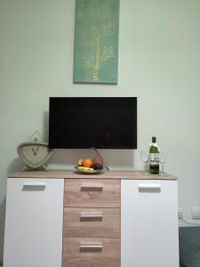 TV a/nebo společenská místnost v ubytování Apartament MaxMax + 30 fotografií