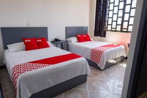 Ένα ή περισσότερα κρεβάτια σε δωμάτιο στο Hotel Puerta Sur