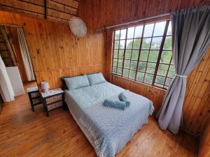 Postel nebo postele na pokoji v ubytování Ratel Retreat