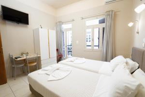 Postel nebo postele na pokoji v ubytování Balcony Studio + 11 fotografií