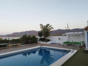 a swimming pool with a view of the mountains at Villa Calamaco in Los Gallardos