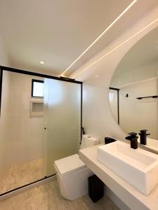 a bathroom with a sink and a toilet at La bardot boutique Pousada in Búzios +76 photos