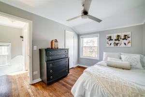 a bedroom with a black dresser and a bed at 2 Mi to Calumet Park and Beach Windy City Escape! in Chicago
