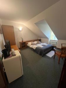 Postel nebo postele na pokoji v ubytování Apartmány BAROKO