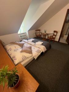 Postel nebo postele na pokoji v ubytování Apartmány BAROKO