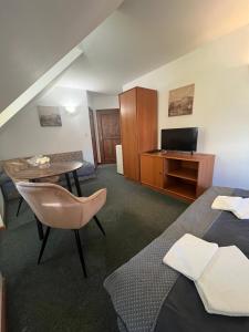 Postel nebo postele na pokoji v ubytování Apartmány BAROKO