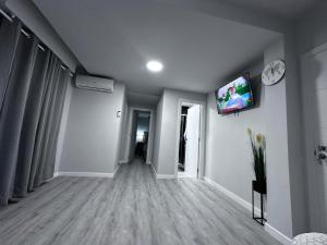 a living room with a tv on a wall at TAJ house center altea #A in Altea