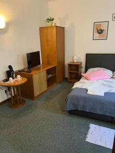 Postel nebo postele na pokoji v ubytování Apartmány BAROKO