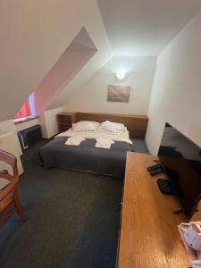 Postel nebo postele na pokoji v ubytování Apartmány BAROKO