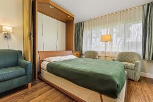Letto o letti in una camera di Lehigh Resort Club