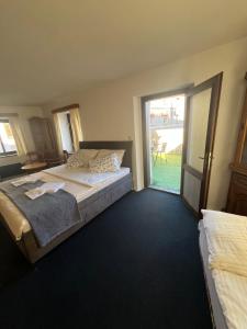 Postel nebo postele na pokoji v ubytování Apartmány BAROKO