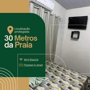 a poster for a hospital room with a bed at Pousada Irmãos Perrone in Maués