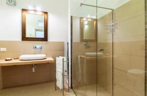 a bathroom with a glass shower and a sink at Casa Marsalia in Marsala