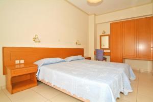 A bed or beds in a room at Sagittarius Apartments