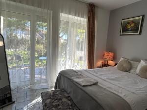 Postel nebo postele na pokoji v ubytování Pansion Vila Vanda Vukovar