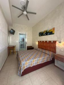 Ένα ή περισσότερα κρεβάτια σε δωμάτιο στο Bed & Breakfast Delle Palme