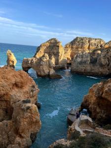 a group of rocks in the water near the ocean at Casa Sam Lagos in Lagos +22 photos