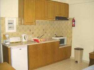 A kitchen or kitchenette at Sagittarius Apartments