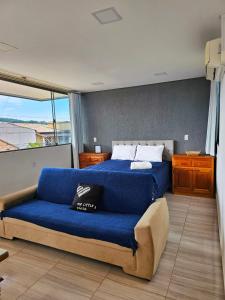 En eller flere senge i et værelse på Hotel Backdoor