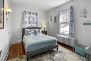 a bedroom with a bed and a window at Grove Place Beach West Haven in West Haven +43 photos