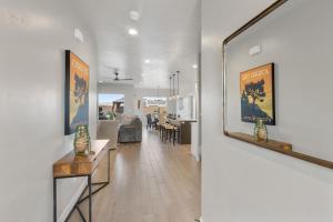 a hallway with a living room and a dining room at Luxury Poolside Retreats Near Zion l Private Pools in Hurricane