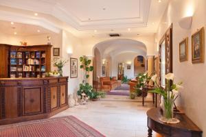 a large living room with a couch and a table at Torre Bennistra in Scopello