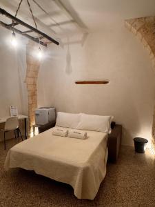 Postel nebo postele na pokoji v ubytování Borgo Sant Angelo