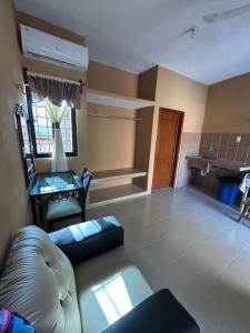 a living room with a couch and a table at Hostal Rosy in Valladolid