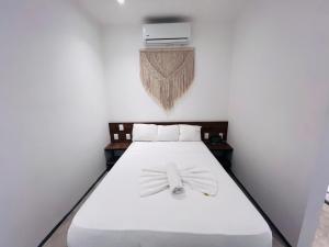 Postel nebo postele na pokoji v ubytování Coco Live Suites