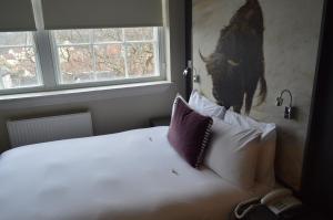 Postel nebo postele na pokoji v ubytování B+B Edinburgh