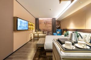 Posezení v ubytování Echarm Plus International Hotel Ouzhuang Metro Station Branch - Free Deliver Service to Canton Fair Complex During Canton Fair Period